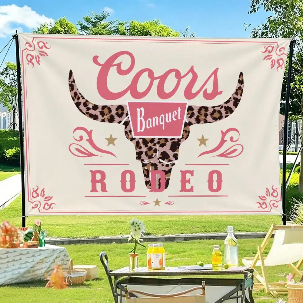 A pink and black decorative flag banner featuring a bull skull design with the words Coors Banquet Rodeo