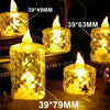 A collection of gold-toned LED crystal candles in various sizes and shapes, showing realistic flickering light.
