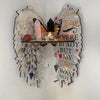 A boho wood angel wing wall shelf featuring a display holder with crystals and a heart message