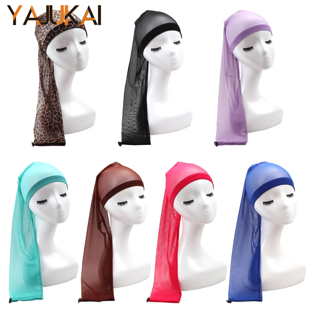 A collection of stretchy hair net caps with drawstring sleeves in various colors including black, purple, teal, brown, and pi