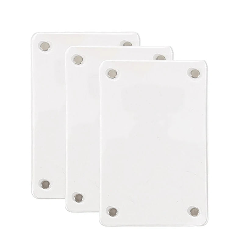 Three white photo clips used for interior decor