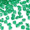Green decorative crushed diamond acrylic pebbles scattered on a white background