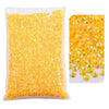 Bag of yellow resin rhinestones with varying sizes and shapes