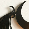 Black gothic bat and crescent moon wall decor mounted on a white wall
