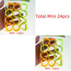 A clear plastic bag shows 24 colorful spring toys in yellow, orange, and lime green rings.