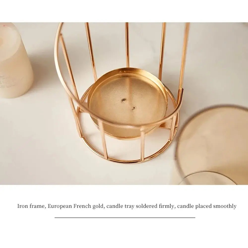 A brass iron frame candle tray is shown with a glass candle placed smoothly on top.