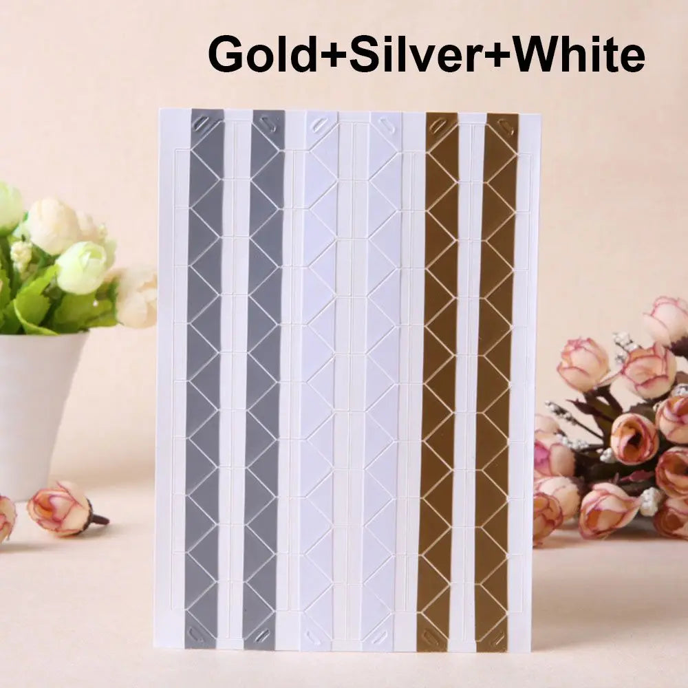 A set of Gold Silver and White PVC photo corner protectors for scrapbooking and albums.