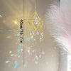 A gold crystal hanging suncatcher decoration with dangling clear and colored glass beads.