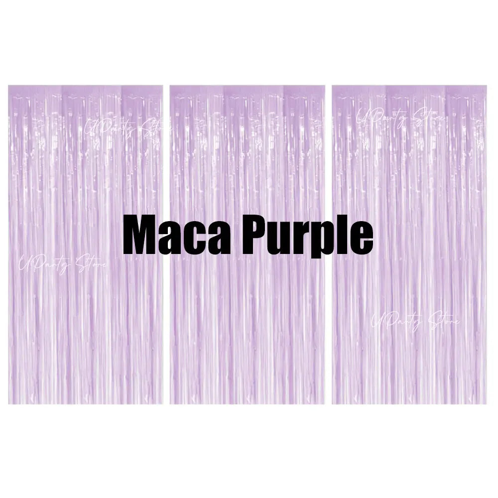 Three vertical panels of purple metallic foil fringe curtains for party backdrop decor.