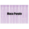 Three vertical panels of purple metallic fringe curtains used as a party backdrop decor.
