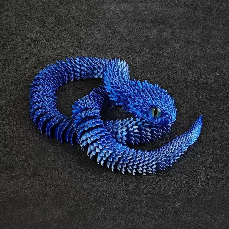 A vibrant blue 3D printed rotatable snake art model resting on a dark surface.