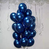 A bouquet of luminous blue latex balloons hanging against a white background.