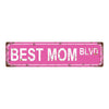 A distressed pink metal tin sign with the text BEST MOM BLVD