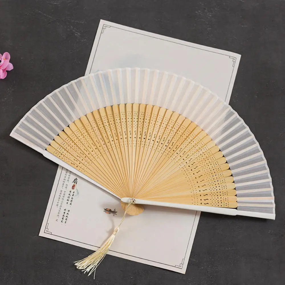 Traditional Bamboo Folding Fan with Solid Color Design