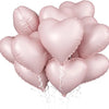 A cluster of pink heart-shaped foil balloons tied together for a celebration.