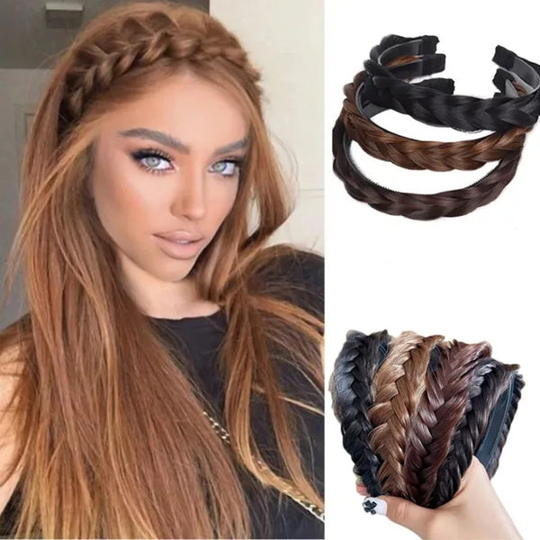 A woman shows off long brown hair styled with black and brown braided hair bands.