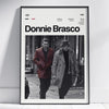A framed black and white poster featuring a scene from a movie, titled Donnie Brasco, with credits and a 1997 date.