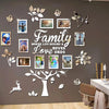 A wall collage featuring various family and love-themed silhouette stickers arranged in a tree design.