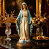 A religious figurine set depicting the Blessed Mother and Jesus Heart in a golden and blue draped figure.