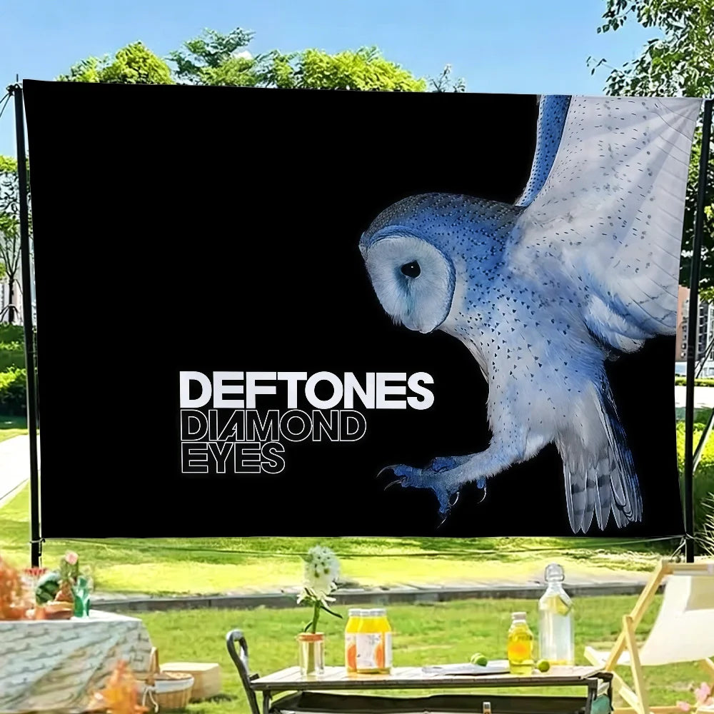 A black flag featuring a white illustration of an owl with diamond eyes.