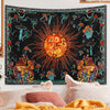 A tapestry featuring a celestial sun design with various mushrooms and zodiac art in orange, green, and black.