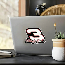 A vinyl decal featuring the number 3 in black and white with stylized text on a laptop.