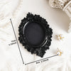 Black ornate frame wall decor pendant with pearl accents shown on a white surface.
