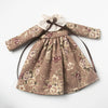 Vintage lace pajama set for a doll featuring a floral print in beige and pink tones.