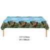A banner featuring dinosaurs, palm trees, and a blue sky for a birthday party decoration kit.