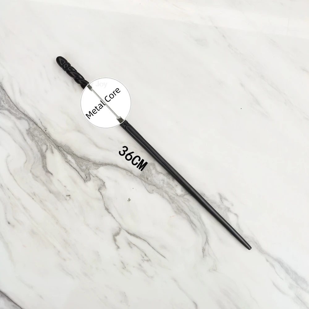A black metal magic wand replica with a 36cm length lying on a white marble surface.