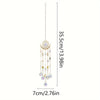 A hanging gold flame moon crystal sun catcher with multiple dangling charms.