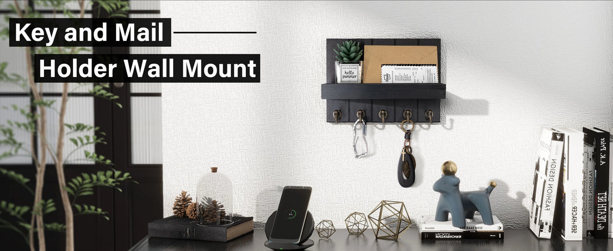 A rustic wooden wall mount organizer for keys and mail featuring five hooks, displayed on a white wall.