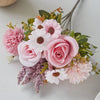 A bouquet of artificial silk pink and white flowers including roses and daisies arranged for weddings or home decor.