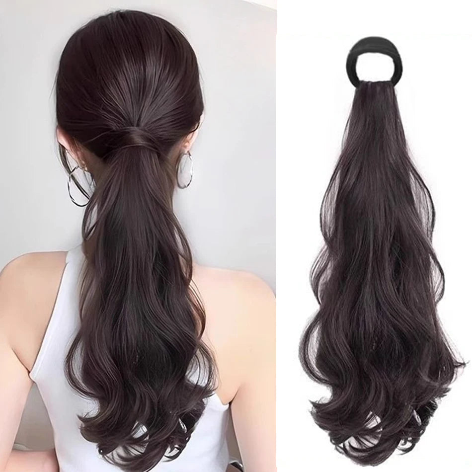 Long black heat resistant synthetic ponytail hair extensions styled in a low ponytail