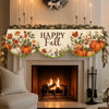 Autumn harvest fireplace mantel scarf featuring maple leaves and pumpkins above a roaring fire.
