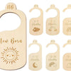 A set of seven wooden baby closet dividers featuring rainbow and cloud designs for newborn to three-six months.