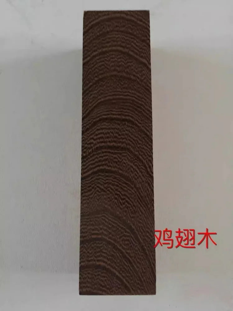 A vertical close-up of dark brown wood grain, likely a blank for knife handles or DIY projects.