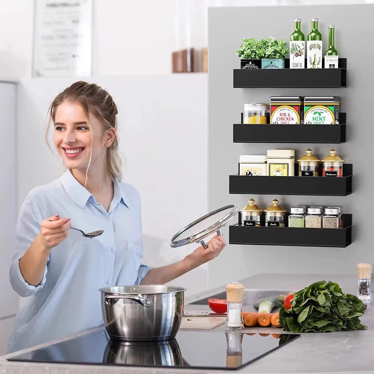 A woman demonstrates a magnetic spice rack for refrigerator, showing various spices and herbs.