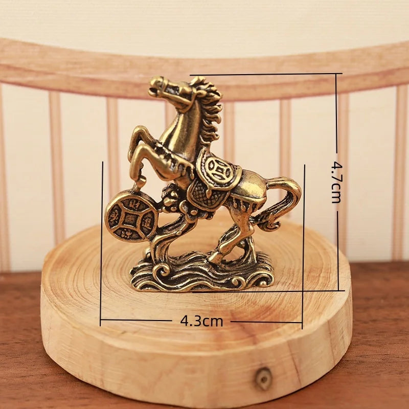A solid copper figurine of a horse for prosperity and positive energy, displayed on a wooden base.