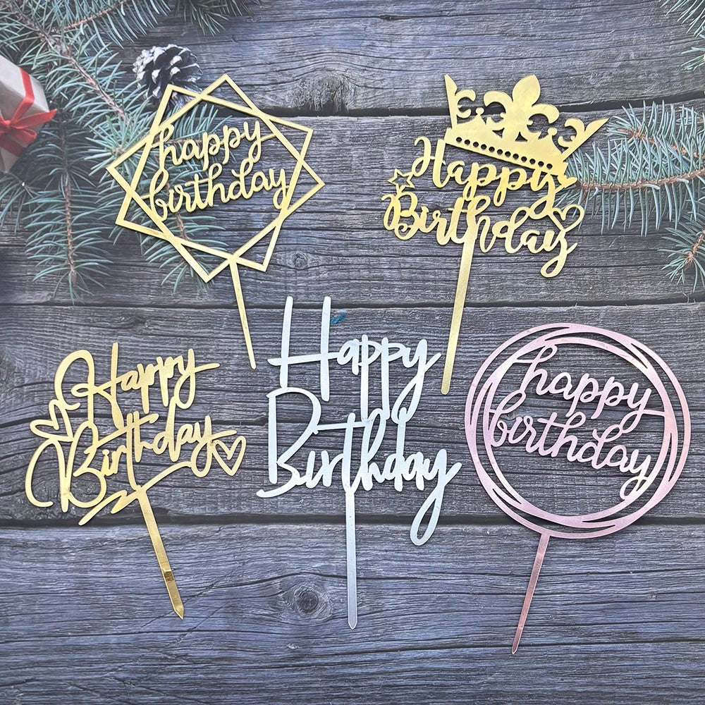 A collection of gold and rose gold acrylic cake toppers featuring birthday messages like Happy Birthday