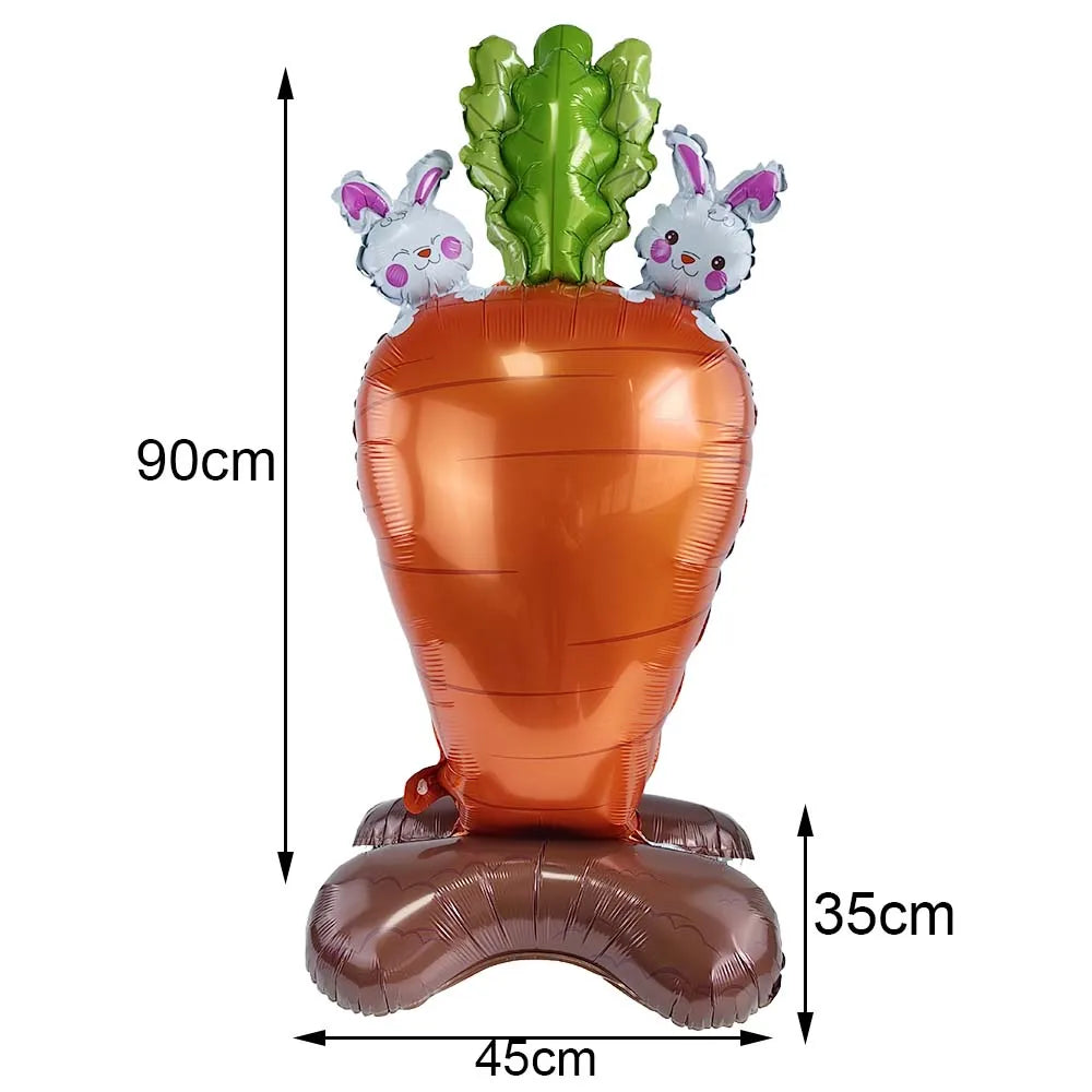 A large orange carrot shaped balloon with three white bunny foil balloons on top.