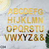 Gold acrylic alphabet letter cake topper set spelling out the entire English alphabet