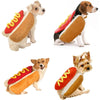 A dog wearing a classic hot dog costume with a sausage shape and bun in orange and yellow tones.