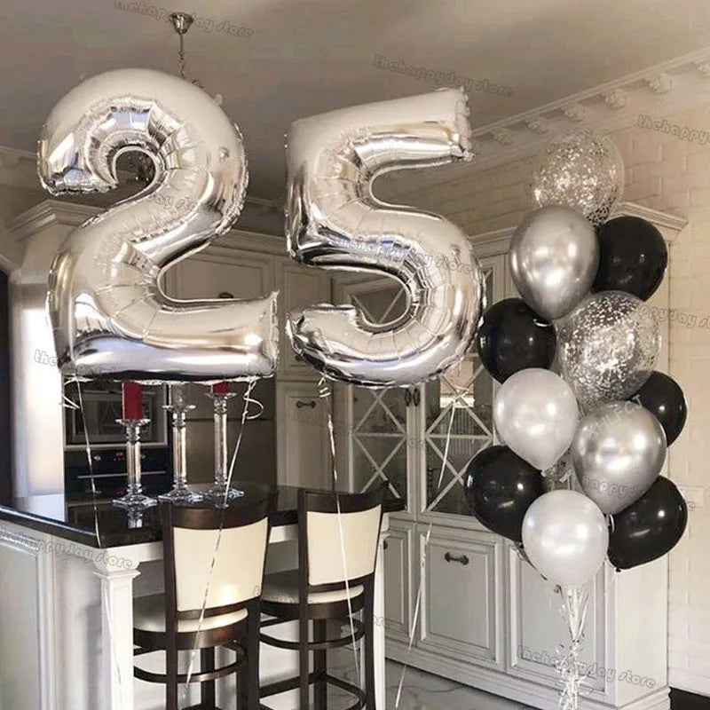 Silver foil balloons shaped like the numbers 2 and 5 arranged in a balloon bouquet