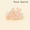 A cluster of pink Rose Quartz crystals with gold inclusions.