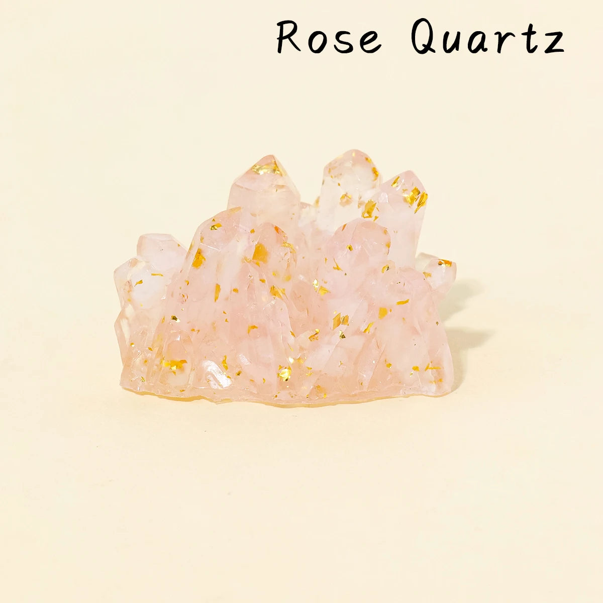 A cluster of pink Rose Quartz crystals with gold inclusions.