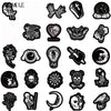 A collection of black and white cartoon skull stickers for decoration.