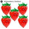 Five red strawberry shaped foil balloons, 33x55cm, for party decorations.