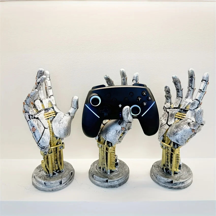A set of three hand-shaped metal organizers for storing 3D gamepads and controllers.