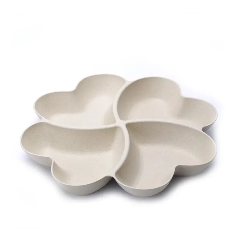 A light beige heart-shaped four-compartment snack tray with rounded edges.